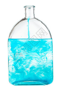 白底孤立的瓶子中蓝染料溶于水中孤立的瓶子蓝染料溶于水中图片