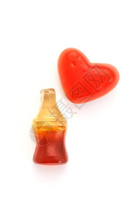 果冻瓶小吃白色背景的糖可口乐瓶和心糖子果冻设计图片