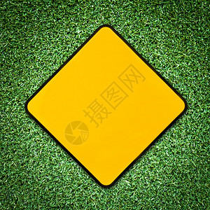 质地象征绿草上黄色符号的背景警告图片