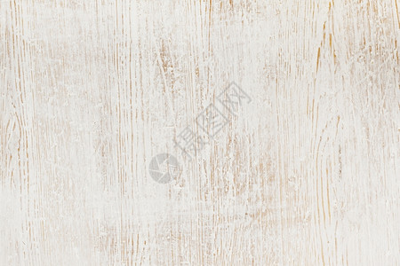 风化木材背景纹理上的旧白油漆木制垃圾摇滚图片