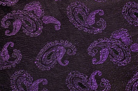 纺织品结构体紫色的和黑花织物背景图片
