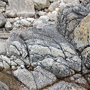 质地难的花岗岩爱尔兰Donegal县Cruit岛巨石岩层图片