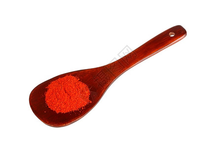 红色的食物香料木勺上辣椒粉图片