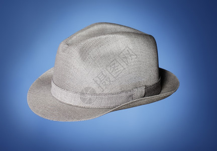 蓝色背景的灰古董三角帽服装老的1950年代图片