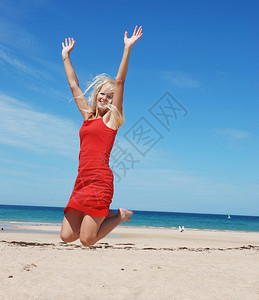 头发裙子女人跳上海滩金发背景图片