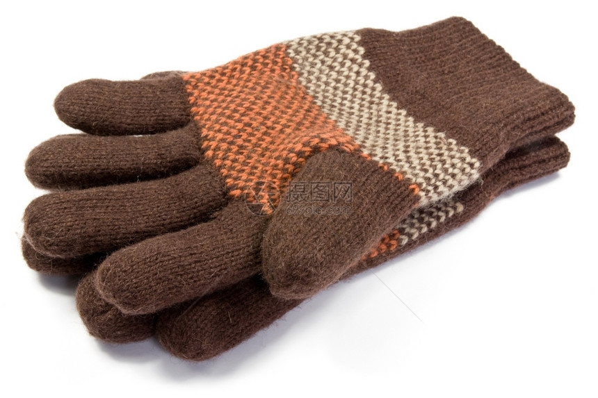 冬天针织的蓬松白色背景温暖羊毛编织手套图片