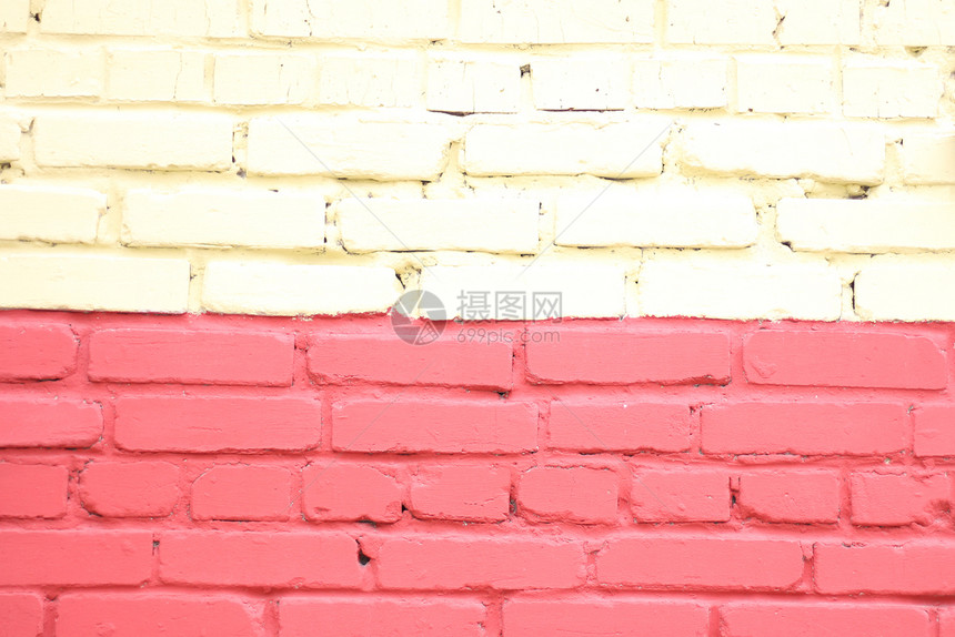 背景和纹理漆成黄红砖墙修理切碎的水泥图片