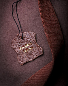缝皮带标签有全谷类皮带文字塞在金子中包皮革图片