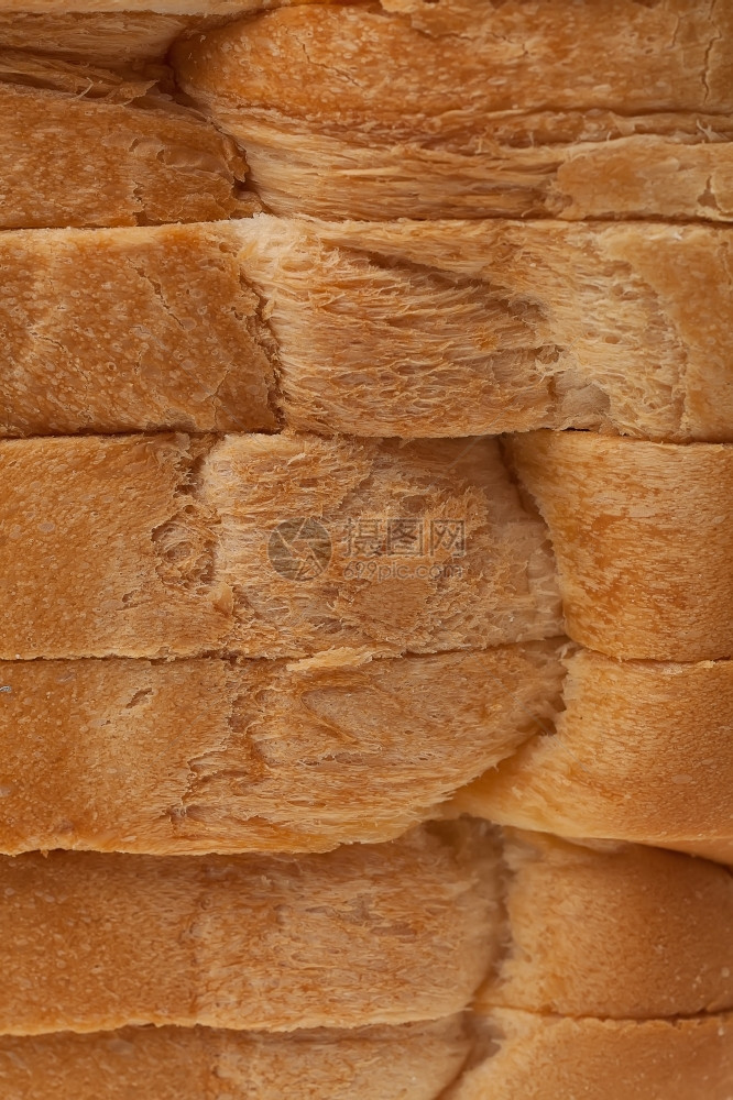 白色的小麦棕面包堆产品图片