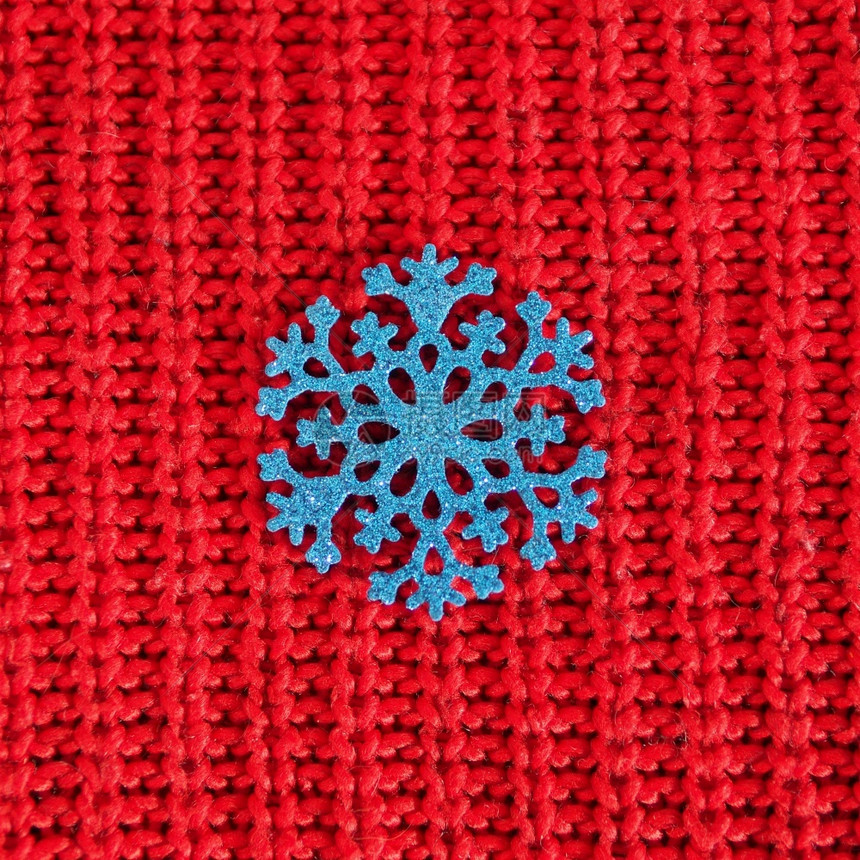 闪光红色的编织背景蓝闪亮雪花毛衣图片