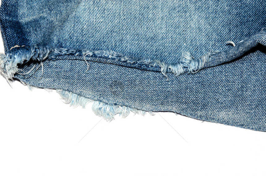蓝色牛仔裤织布的边缘白色背景有边缘美丽蓝色的砖图片