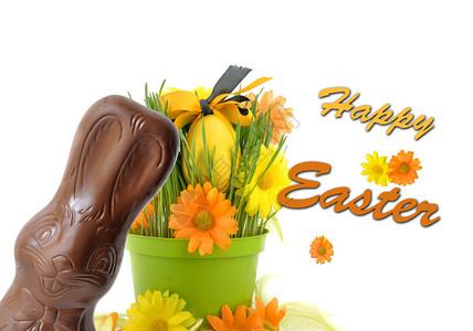 拿花朵小兔子问候白色的季节在东方鸡蛋前的巧克力小兔子花盆里装着文字设计图片
