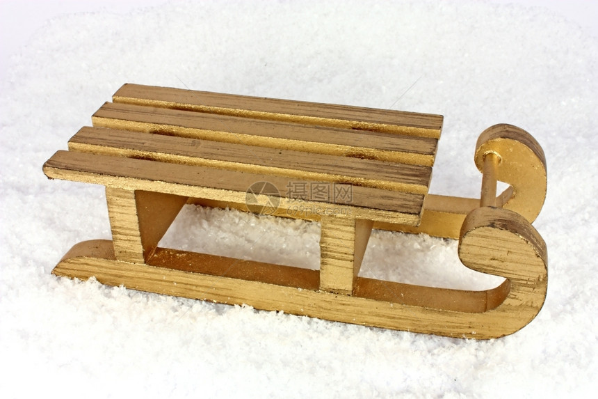 人造雪中金橇玩具木头运动图片