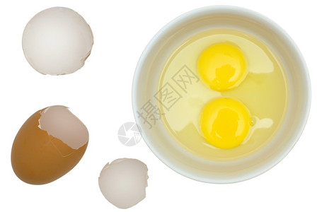 棕色的干净鸡蛋壳白底盘子中粗蛋打破图片