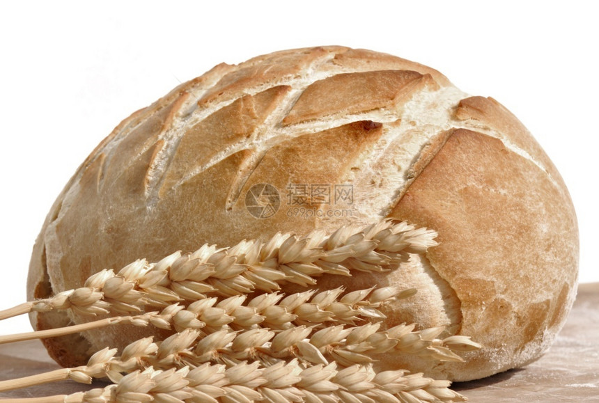 白底面包和小麦耳朵的美金面包脆皮生物烘烤的图片