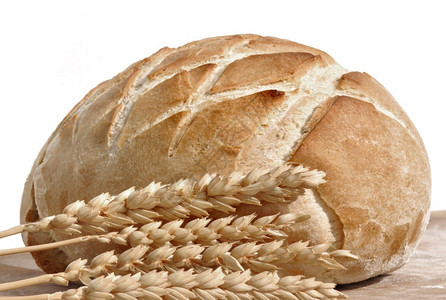 白底面包和小麦耳朵的美金面包脆皮生物烘烤的背景图片