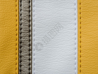 破裂条纹材料黄棕色和白皮革纹理背景缝针背景图片