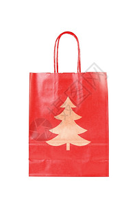 红色纸袋带有圣诞节树符号在白背景上隔离目的解雇象征背景图片