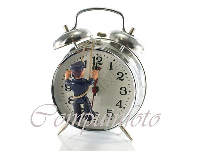 男人绳索修理时钟和铃铛的玩具mna钟声图片
