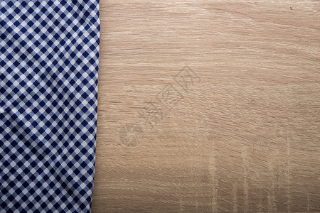 木制背景的蓝餐巾纸和木制背景的蓝色餐巾纸厨房装饰风格方的图片