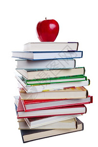 丰富多彩的白色一堆书本上面有亮红苹果在白背景上拍一张照片最佳背景图片