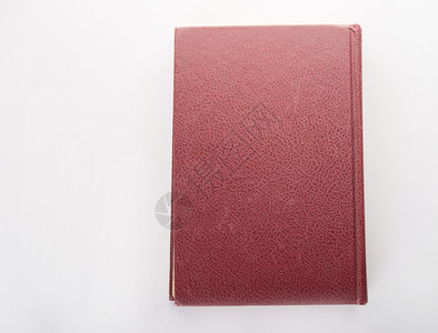 在白色背景上被孤立的红皮笔记本书学习白色的图片