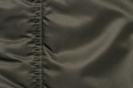 绗缝夹克抽象的Khaki画布背景波浪状的服装背景