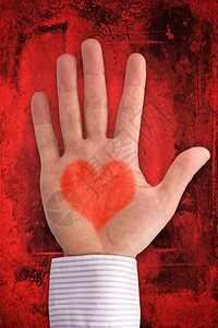 按摩浪漫象征深红背景的心型爱之手以深红背景为心脏形状背景图片