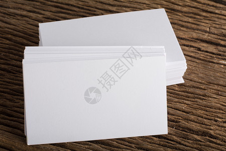 商业企形象的空白色名片演示文稿在木背景上的企业形象空白色名片演示文稿公司卡片背景图片