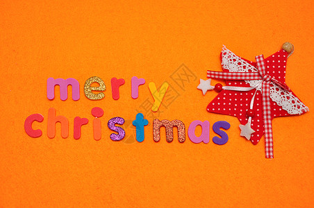 装饰红星和圣诞快乐在橙色背景上象征明亮的图片