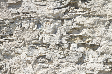 缩略白石墙背景或刻划白石墙的纹理缩略白石墙背景岩棕色的具体图片
