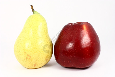黄色的成熟提取新鲜黄梨和红苹果小吃图片