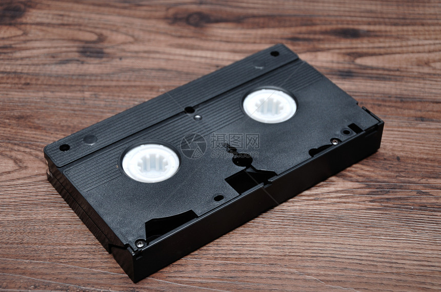 胶带视频优质的木制背景一盒隔绝录影带图片