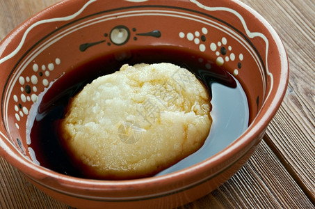 阿西埃努面团流行煮熟的Asida熟小麦粉团在阿尔及利亚比突尼斯沙特阿拉伯厄立里亚埃塞俄比苏丹和也门很受欢迎甜的背景