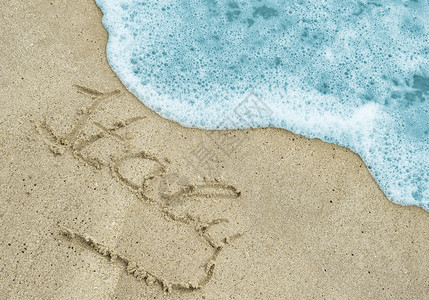 沙滩上的意大利手写字图片