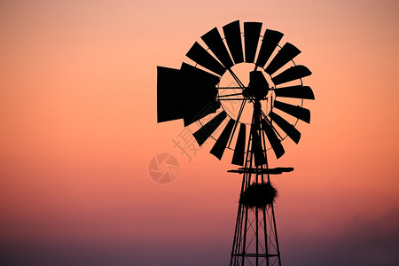环境活力风车映衬着红色的夕阳刀片背景图片