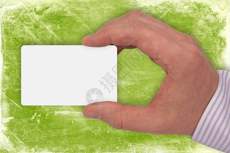 给予专业的绿色背景上带有空白卡的手持信息图片
