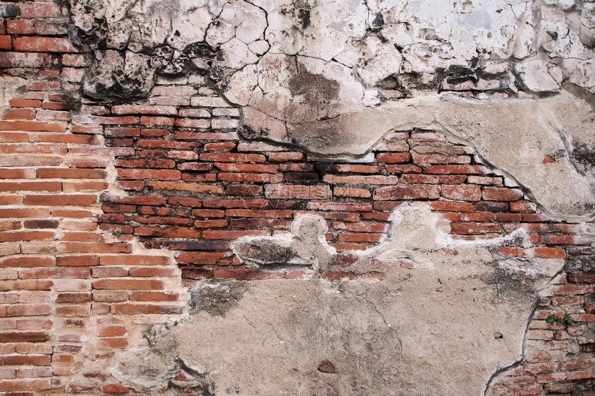 陈年岩石旧砖墙背景或纹理破裂图片