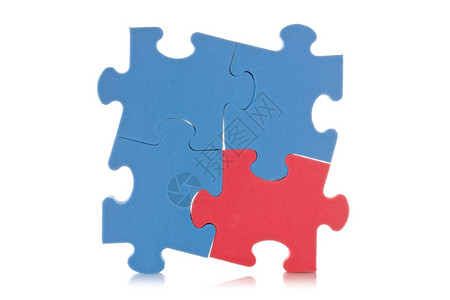 战略使用一个红色片段的蓝拼图符号谜商业图片