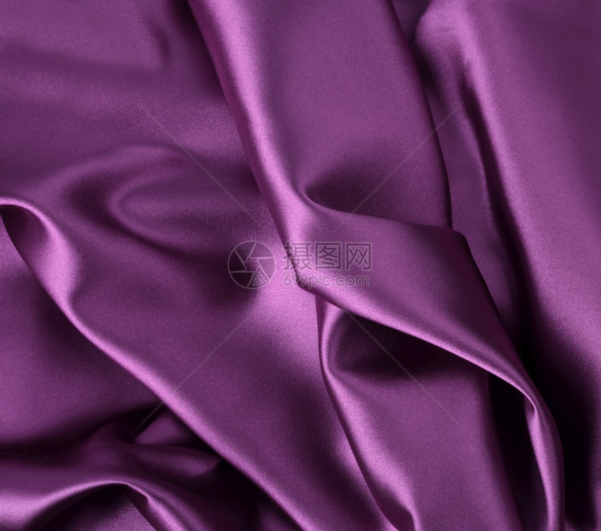 波纹瓦维折叠的奢华豪闪亮的西边丝绸背景瓦维折叠的西边丝绸织物紫色的图片
