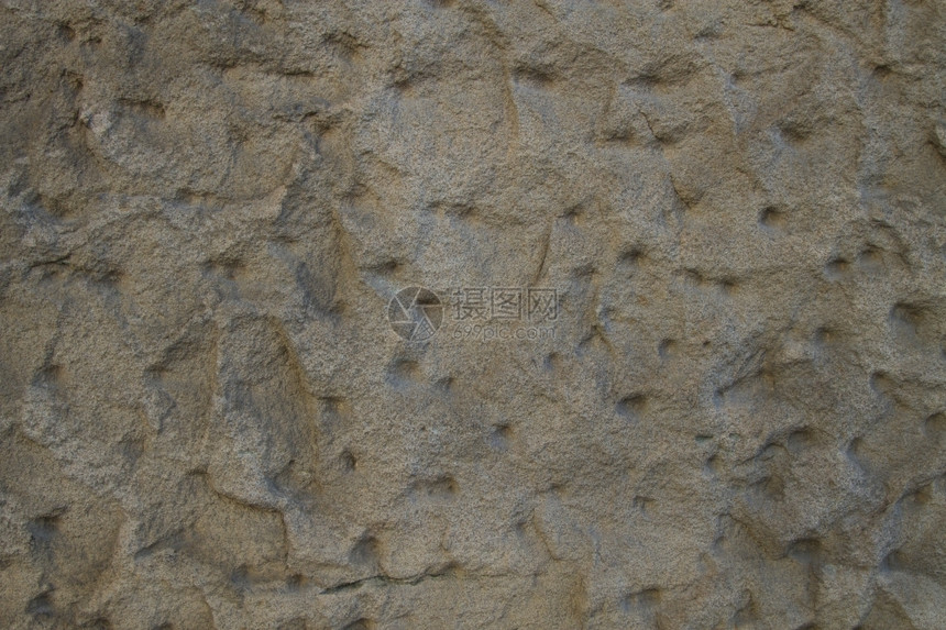 风化泥石墙背景或岩砂的纹理土石墙的背景肮脏灰色图片