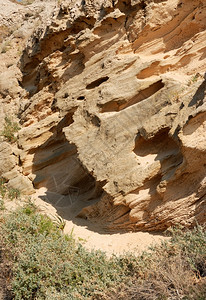 干燥抽象的自然质地多孔岩石的斜坡水平图片
