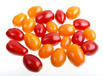 自然水果白底红西番茄和黄双皮西红番茄色的背景图片