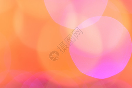 粉红和橘橙布OKH圣诞灯不突出焦点的抽象背景重柔软的墙纸图片