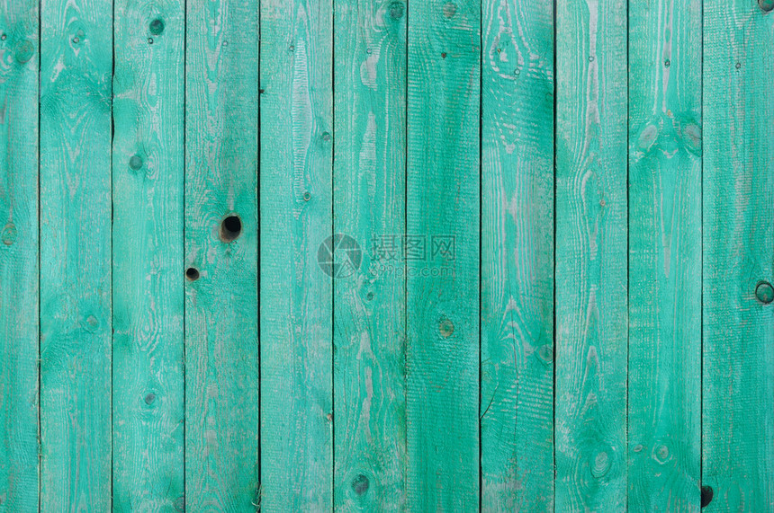 抽象的自然风化绿漆色的有结洞木墙复古图片