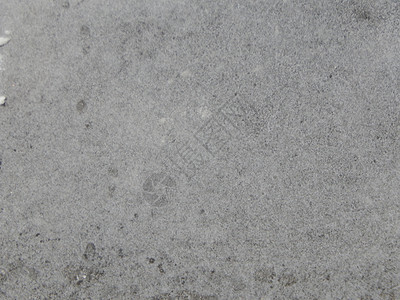 雪的纹理覆盖了地面和沥青天气肮脏的人行道图片