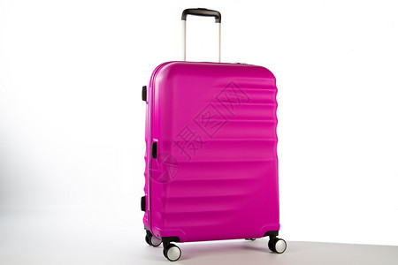笨拙的颜色和白背景非常引人注目的手提箱颜色和白背景非常突出的手提箱粉色塑料手提包设计图片