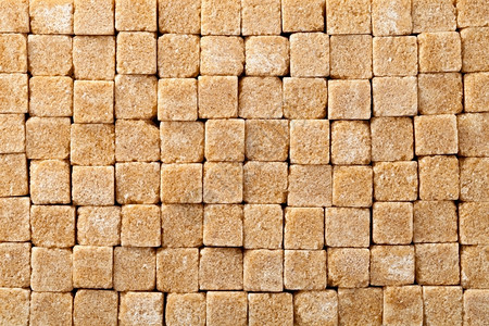 背景的棕色糖立方块的富劳卡立方体图片