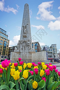城景上市荷兰阿姆斯特丹春季大坝广场上的纪念碑荷兰阿姆斯特丹建筑学图片