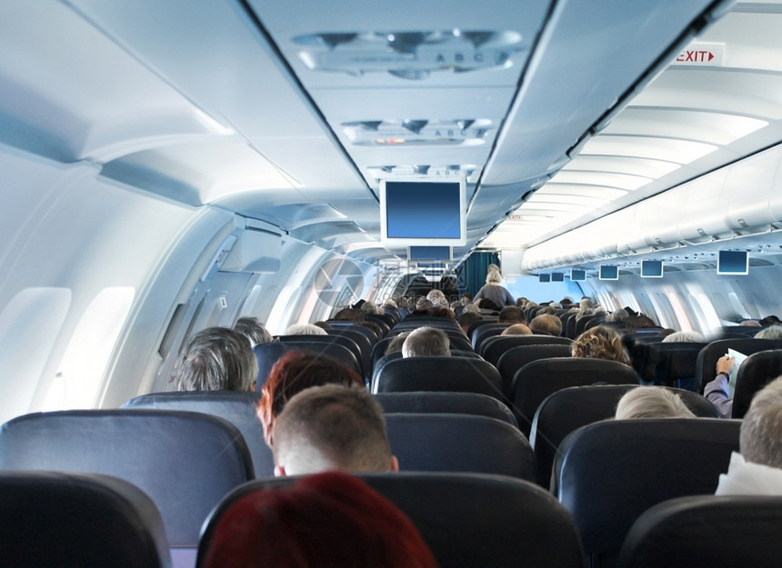 旅行客乘坐飞机舱内经济乘客的视线过高机舱内乘的视线过高旅游椅子图片